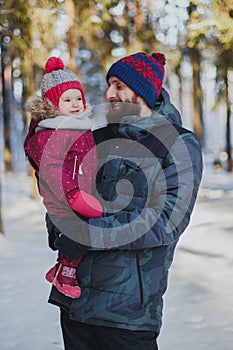 Portrait of happy father and daughter in the winter forest 1