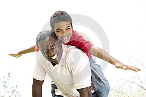 Portrait of Happy Father and Son In Park