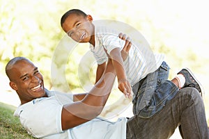 Portrait of Happy Father and Son In Park