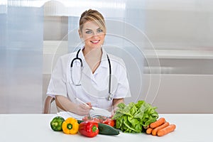 Portrait of happy female dietician photo