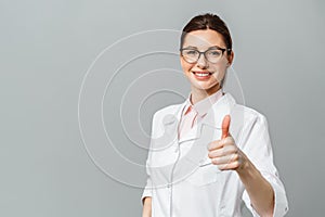Portrait of a happy female doctor showing the OK sign