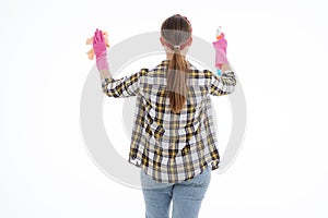 Portrait of happy female doing house duties wearing rubber gloves and holding cleaning equipment. Cheerful look. Hygiene, cleaning