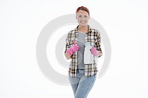 Portrait of happy female doing house duties wearing rubber gloves and holding cleaning equipment. Cheerful look. Hygiene, cleaning