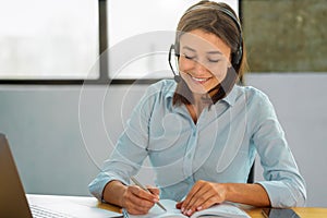 Portrait of happy female employee customer support services in headset online consultation Woman call center