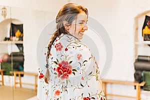 portrait of a happy female flamenco dancer with shawl on her back smiling