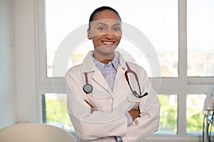 Portrait of happy female general practitioner smiling at camera
