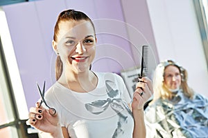 Portrait of happy female hairdresser