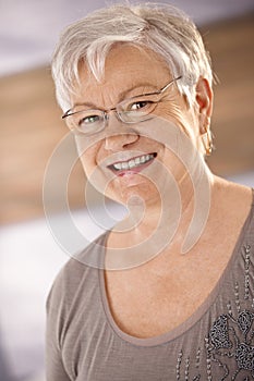 Portrait of happy female pensioner