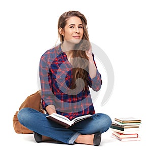 Portrait of happy female student reading a book isolated.