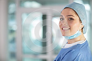 portrait happy female surgeon wearing scrubs