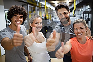 Portrait of happy fit people, friends exercising in gym together. Sport people workout concept