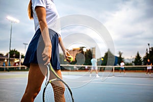 Portrait of happy fit young woman playing tennis. People sport healthy lifestyle concept