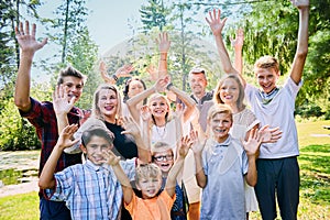 Portrait of happy foster family laughing in park