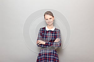 Portrait of happy friendly young woman holding arms folded and smiling