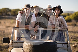 Portrait of happy friends enjoying during safari vacation