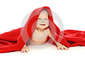 Portrait happy funny little baby under towel crawl