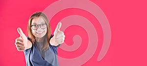 Portrait of happy funny teen girl over red background