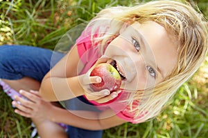 Portrait of happy girl with apple