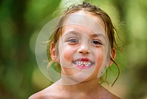 Portrait of happy girl child is smiling enjoying adopted life.