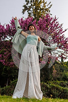 portrait of a happy girl. urban style and fashion. A young brunette is having a happy and fun time, the girl is smiling. Young