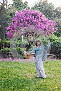 portrait of a happy girl. urban style and fashion. A young brunette is having a happy and fun time, the girl is smiling. Young