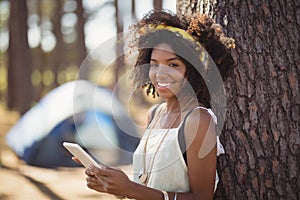 Portrait of happy girl using smart phone
