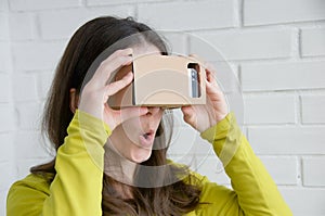 Portrait of happy girl in vr glasses. Virtual reality concept. People using technology. Futuristic background