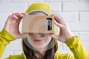 Portrait of happy girl in vr glasses. Virtual reality concept. People using technology. Futuristic background