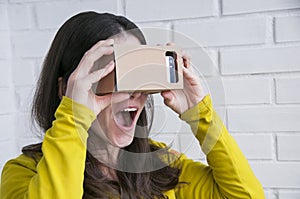 Portrait of happy girl in vr glasses. Virtual reality concept. People using technology. Futuristic background