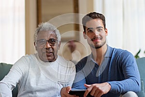 Portrait of happy grandfather and grandson having day together