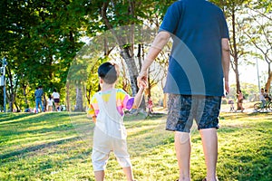 Portrait of happy grandson holding hand of grandmother over  nature park outdoor background