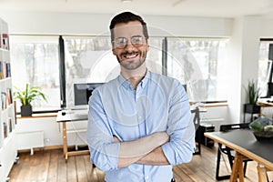 Portrait of happy handsome 30s businessman in eyeglasses.