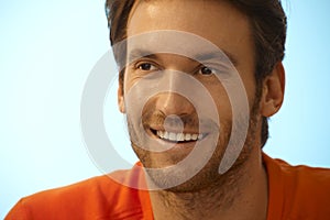 Portrait of happy handsome casual man with stubble