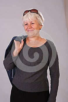 portrait of happy healthy middle aged woman, Smiling pleasant elderly mother looking at camera, posing for photo