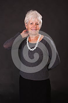 portrait of happy healthy middle aged woman, Smiling pleasant elderly mother looking at camera, posing for photo