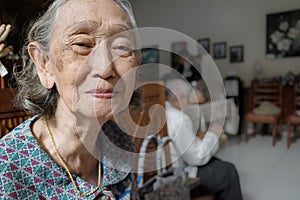 Portrait of happy and healthy Southeast Asian senior woman in her 80s