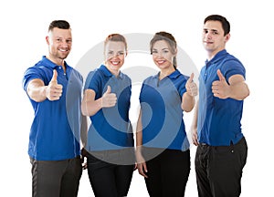 Portrait Of Happy Janitors Showing Thumb Up Sign
