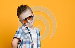 Portrait of happy joyful beautiful little boy, studio shot in white t shirt