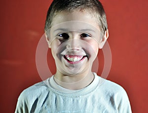 Portrait of happy joyful cute little boy, studio shot