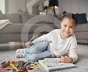 Portrait of happy kid, girl and pencils for coloring on living room floor for education, learning and creative