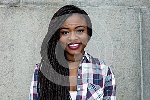 Portrait of a happy laughing african american woman with dreadlocks