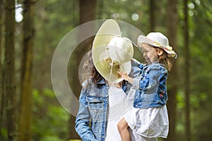 Portrait of Happy and Laughing Caucasian Mother with Her Little Daughter Playing Together