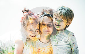 Portrait of a happy laughing children. Smiling kids with face art painting. Child huds with funny face painting.