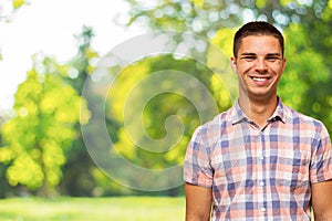 Portrait of happy laughing man in nature