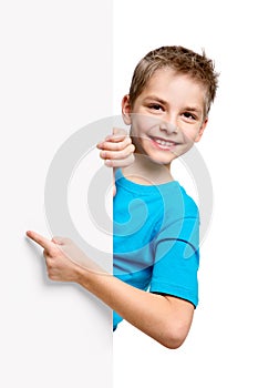 Portrait of happy little boy with white blank