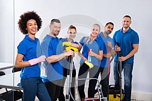 Portrait Of Happy Male And Female Janitors photo