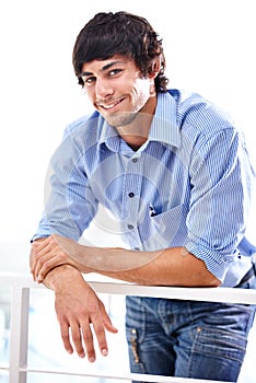 Portrait, happy and man with confidence in career and railing in workplace for developer. Person, smile and face of