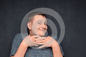 Portrait of happy man making funny naive face