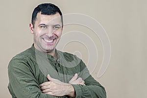 Portrait of a happy man of oriental appearance 30-35 years old on a light background.