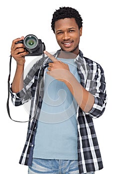 Portrait of a happy man pointing at his camera